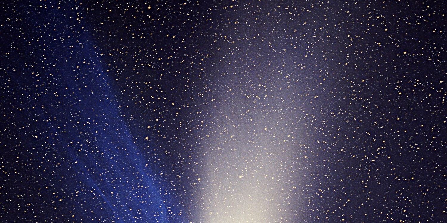 Comet Hale-Bopp with a bright white tail and a fainter blue tail