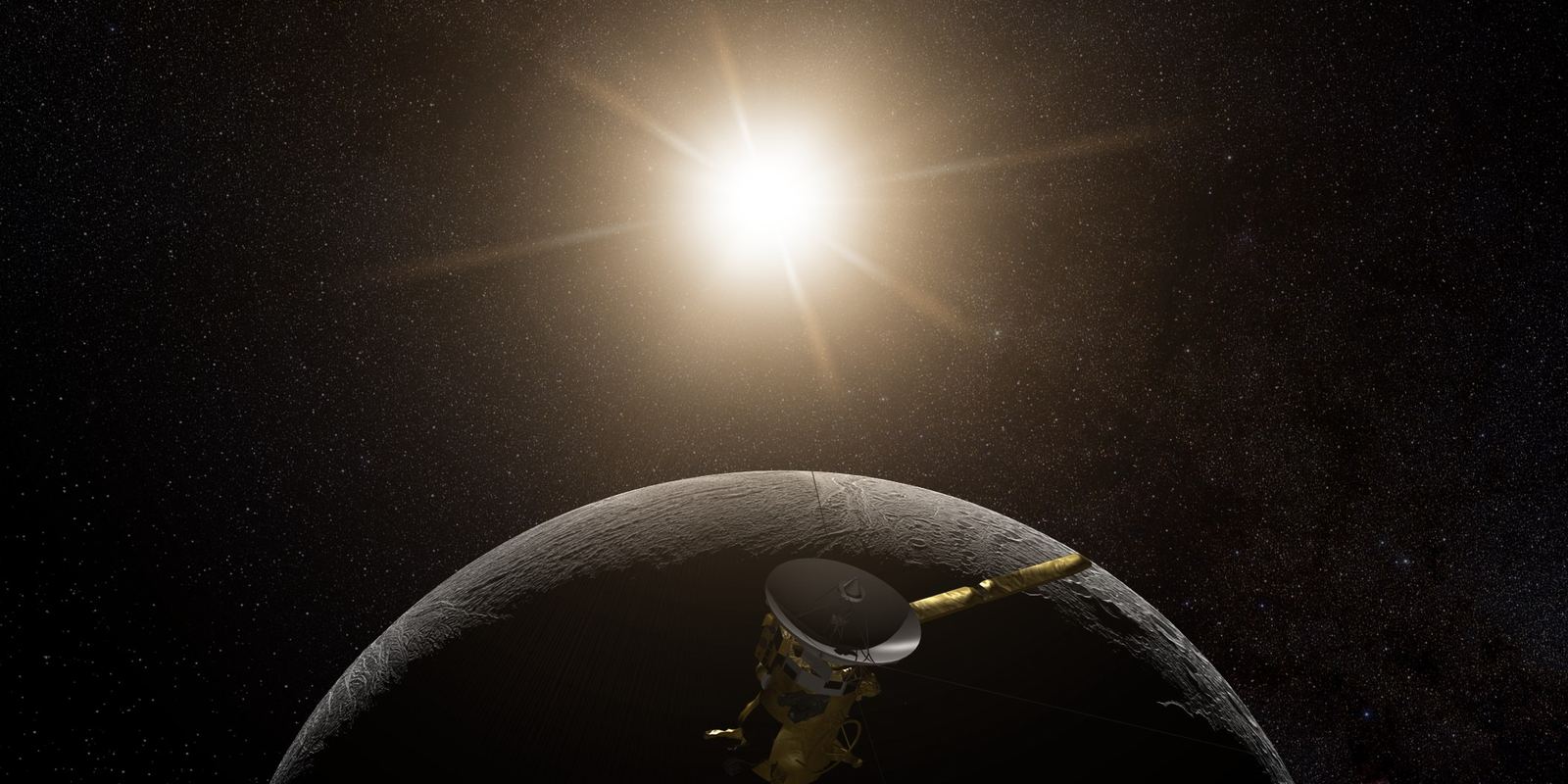 The icy moon Enceladus with Saturn in the background