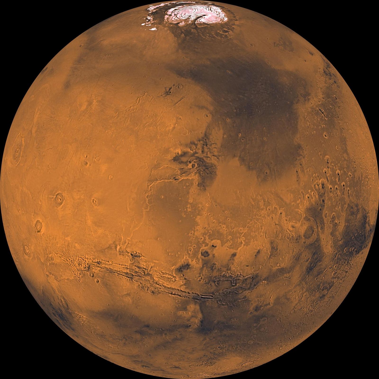 Global color views of Mars showing its rusty red surface, dark markings and polar ice