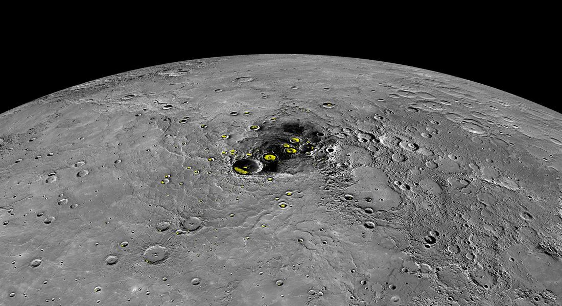 Mercury's north polar region with yellow patches marking craters where water ice is found