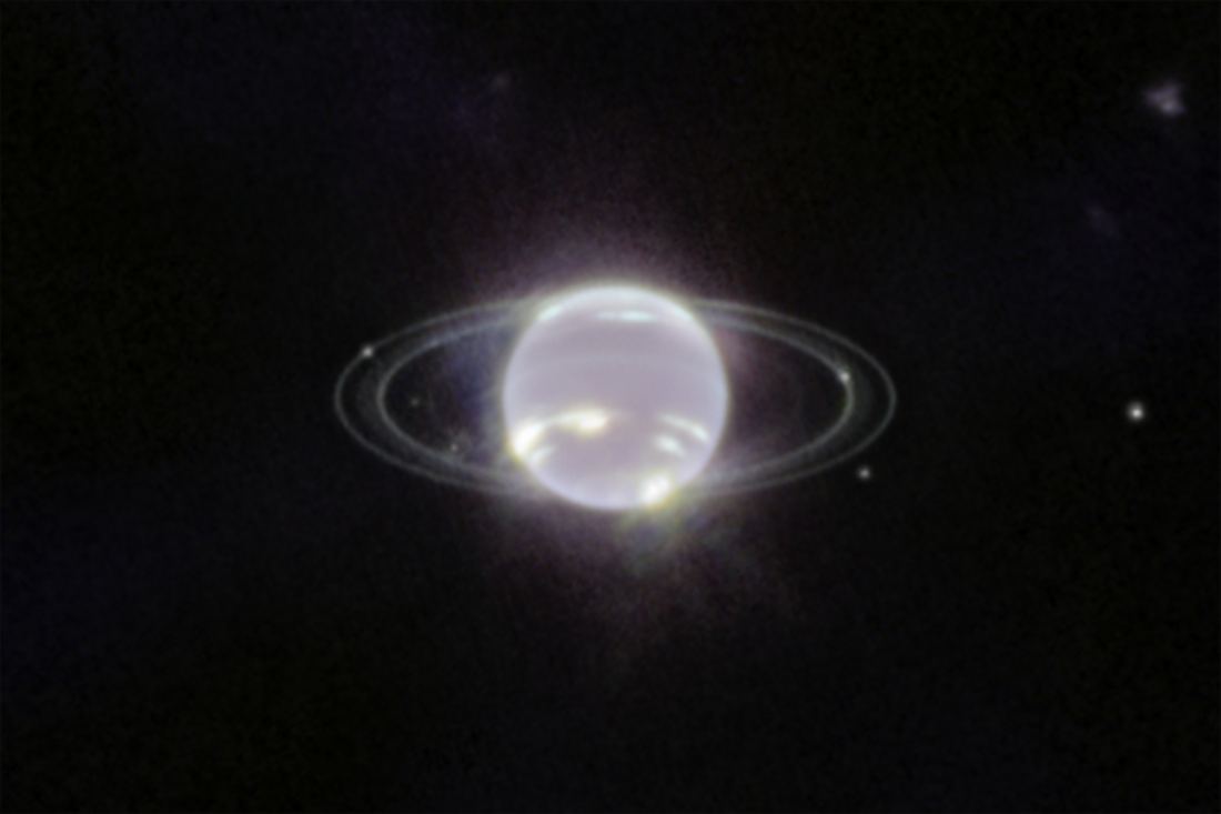 An infrared Webb image of Neptune as a pale globe surrounded by thin, glowing rings